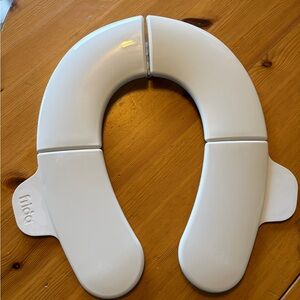 Frida Baby Fold-and-Go Portable Potty Seat for Toilet